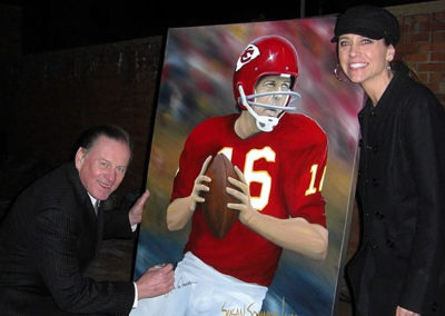 Susan's NFL Painting Being Signed by Len Dawson